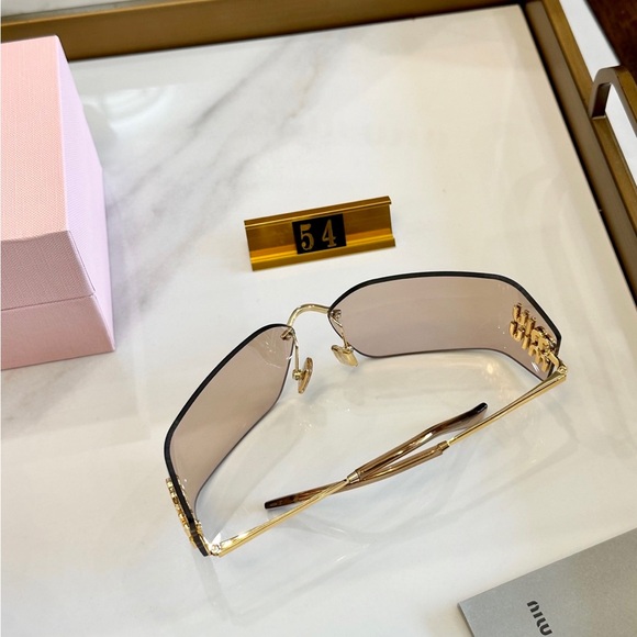 Miu Miu Rimless Sunglasses with Brown Gradient Lenses and Gold Accents